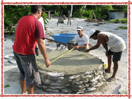 Allan and Jeff, helping build a tank platform from coral, sand  and a little cement. Tanks were almost 6’ across, 4’ high and held about 3000 liters of rainwater.
